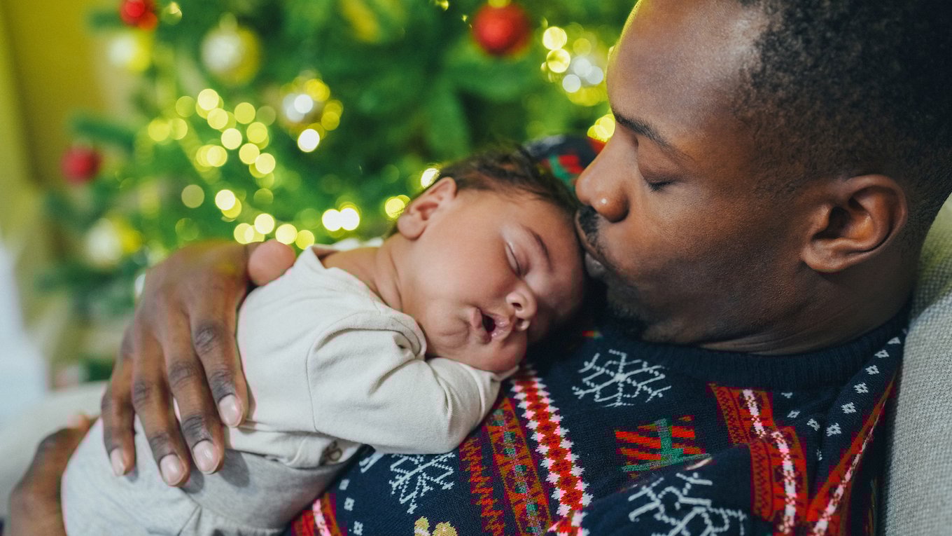 A dad and his sleeping baby